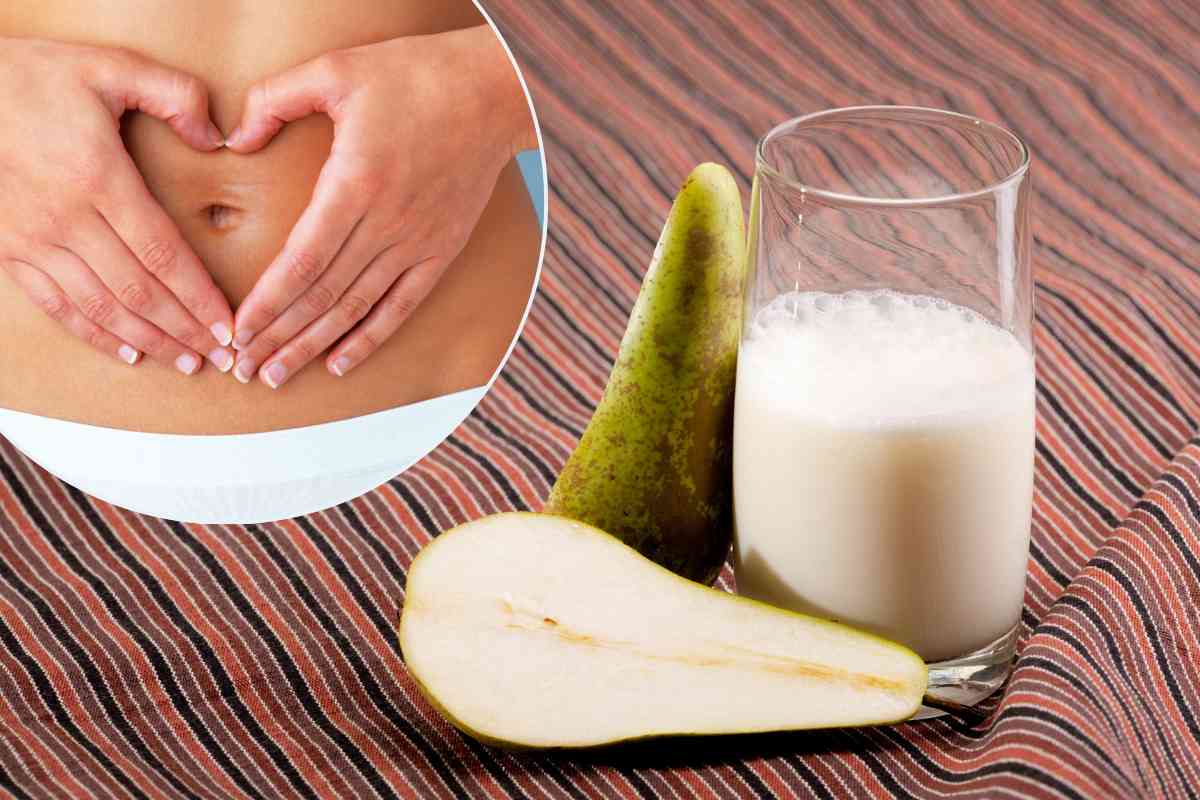 Frullato e pere sullo sfondo. Donna che si tocca la pancia in primo piano