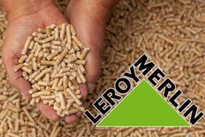 pellet in mano e logo leroy merlin