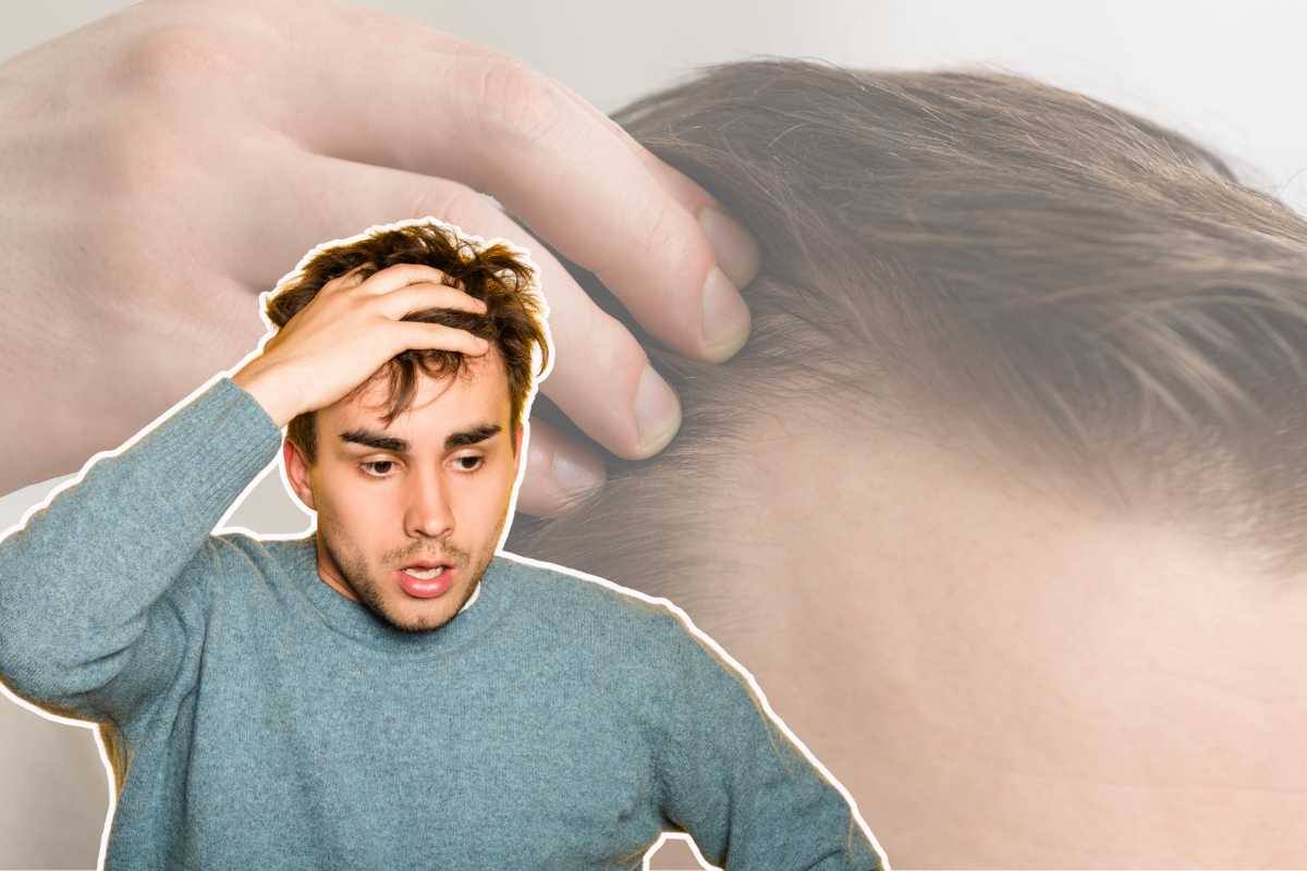 uomo con mano in testa