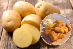 Patate crude nello sfondo e crocchette di patate